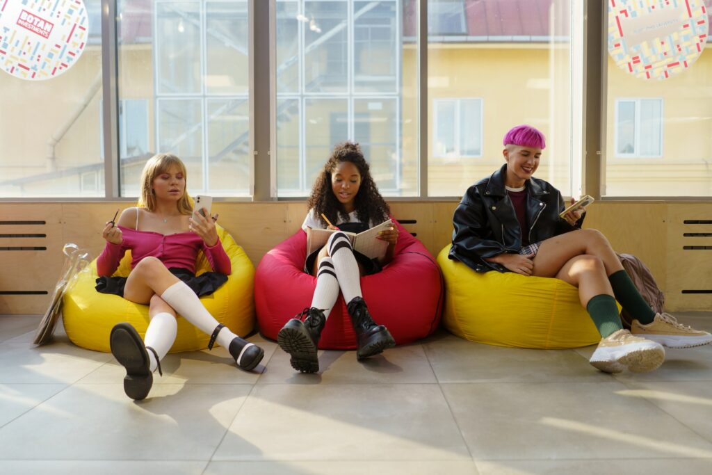 A group of South African youth sitting on bean bag chairs