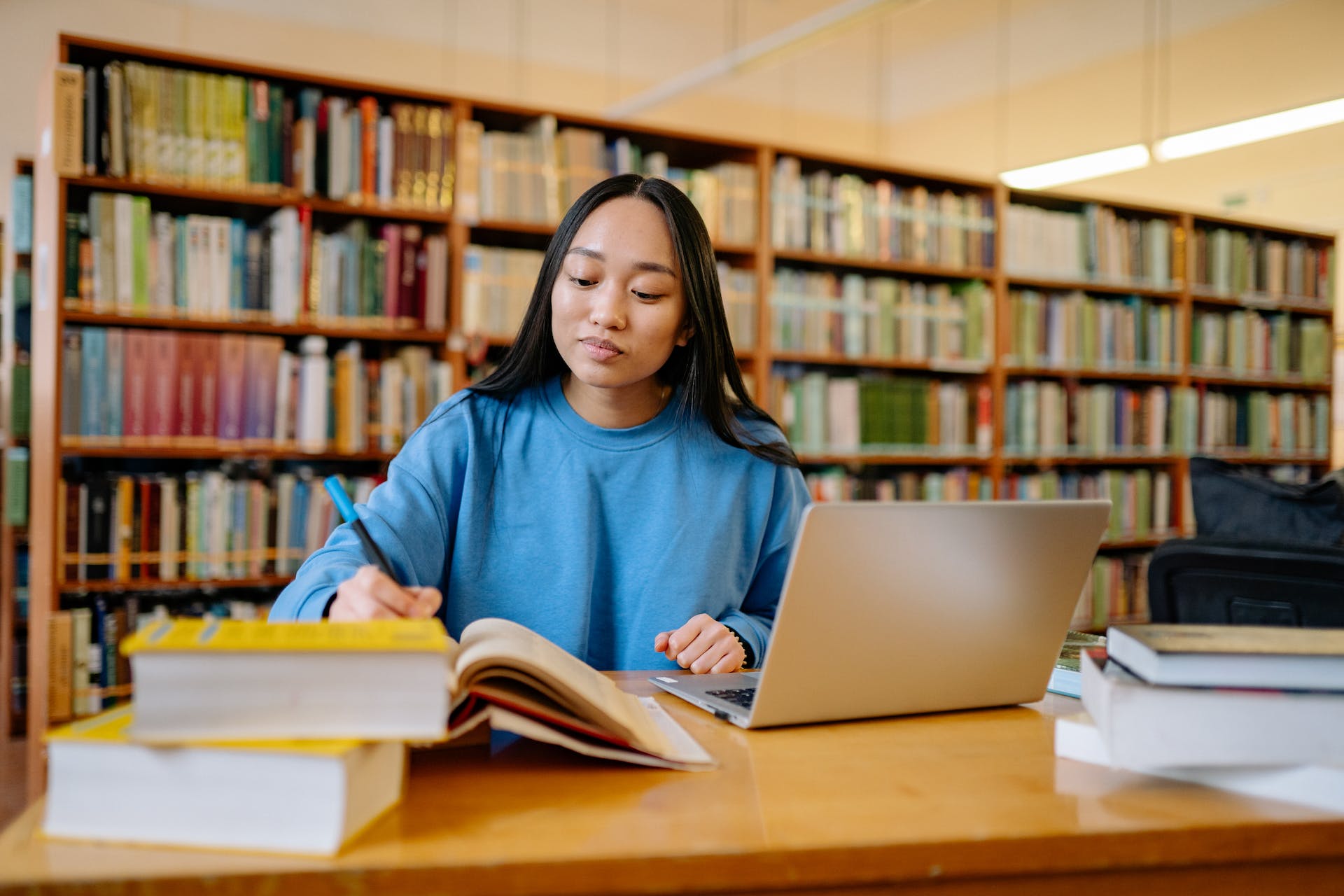 A university students studying in the library, a common sight at the numerous South African universities available