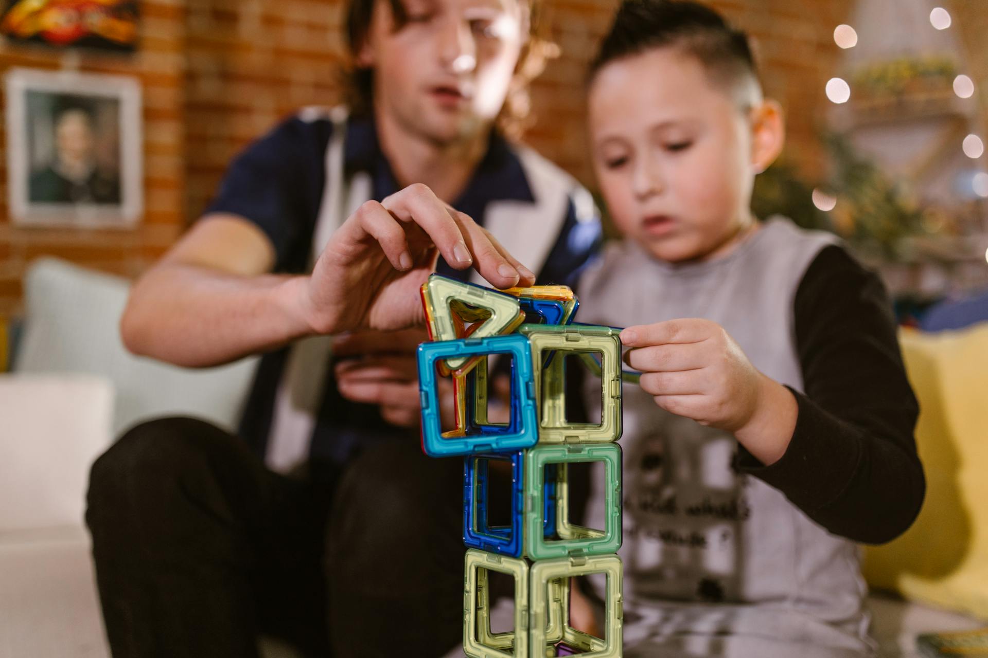 A child playing with building blocks, this is a proven mode of play-based learning