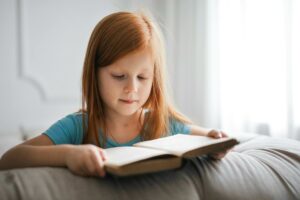 A child reading a book that interests them, this too is a form of self-directed learning